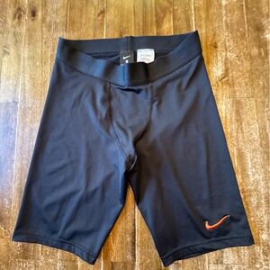 Nike Black Athletic Compression Shorts with Orange Swoosh